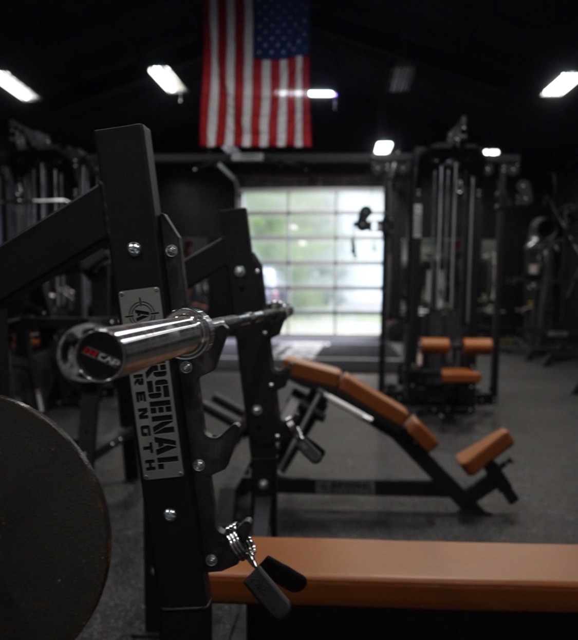 Close-up of the Arsenal Strength logo on equipment inside Strikeline
